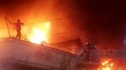 تصاویری از لحظه نجات مرد تهرانی از میان شعله های آتش / فیلم