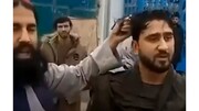 ضرب و شتم یک جوان به خاطر مدل مو توسط مامور طالبانی / فیلم