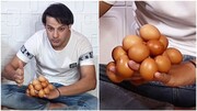 ثبت رکورد جدید در کتاب گینس؛ نگه داشتن ۱۸ تخم مرغ روی پشت دست! / فیلم