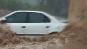 تصاویر آخر الزمانی از سیلاب باغملک | طغیان رودخانه خودرو را با خود برد! / فیلم