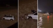تصاویر آخرالزمانی از لحظه گرفتار شدن سرنشینان خودروی لاکچری در سیل عربستان + فیلم