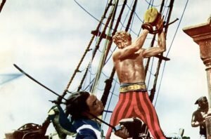 در ادامه این مطلب می خواهیم شما را با برخی از بهترین فیلم های تاریخ سینما در مورد زندگی و ماجراجویی های دزدان دریایی آشنا کنیم.