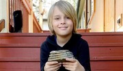 کشف دندان ۱۰ هزار ساله توسط پسر ۹ ساله‌ موقع بازی کردن در خیابان + عکس
